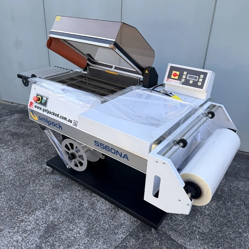 SMIPACK S560NA - L- Sealer Hooded Packer with takeaway Conveyor